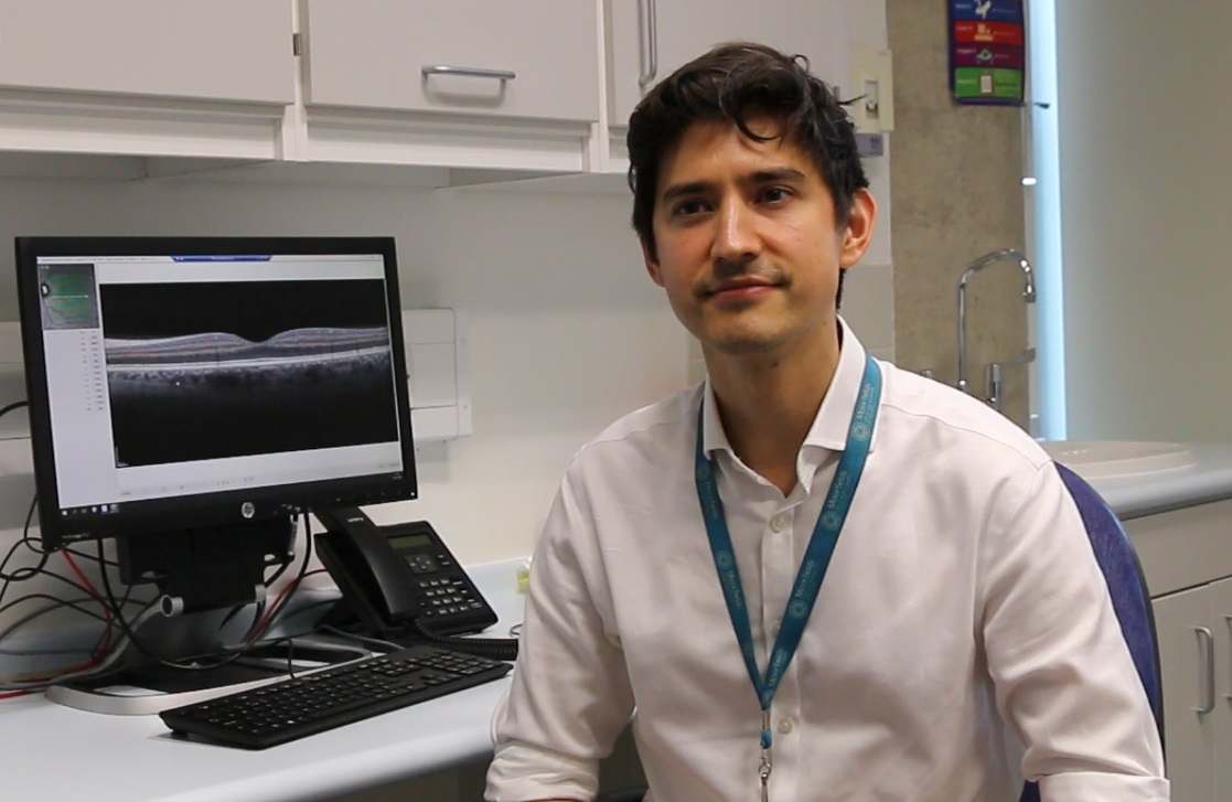 Siegfried Wagner, principal investigator and clinical research fellow at Moorfields Eye Hospital, with an OCT image